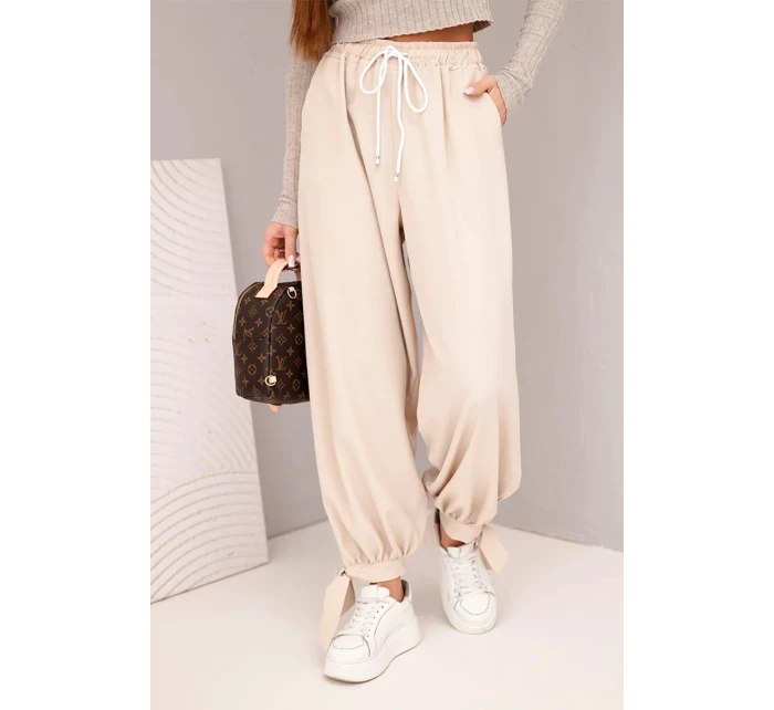 Dámské kalhoty s širokým nohavicí a vázáním dole béžové