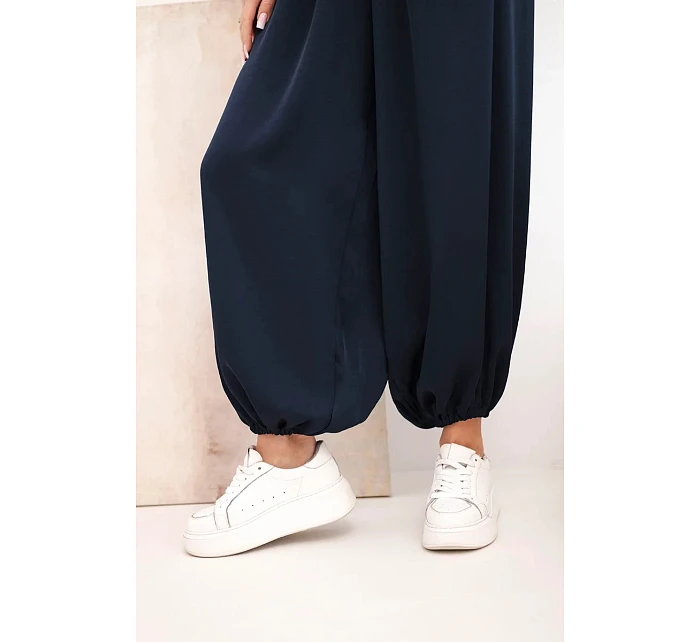 Dámské široké kalhoty s gumou v pase a vázáním typu model 22064417 - K-Fashion Dámské široké kalhoty s gumou v pase a vázáním typu model 22064417 - K-Fashion