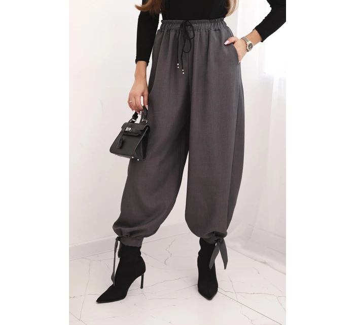 Dámské kalhoty s širokou nohavicí a zavazováním dole grafitové Dámské kalhoty s širokou nohavicí a zavazováním dole grafitové