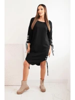 Dámská asymetrická šaty s ozdobnými model 21413453 a rukávem 3/4 modrá - K-Fashion