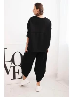 Dámský teplákový komplet z silnějšího materiálu se širokými nohavicemi černý Dámský teplákový komplet z silnějšího materiálu se širokými nohavicemi černý