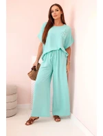 Dámský komplet z viskózy s ozdobným květem a širokými kalhotami - mátový Dámský komplet z viskózy s ozdobným květem a širokými kalhotami - mátový