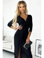 Lesklé černé dlouhé dámské šaty s výstřihem, rozparkem na noze a s brokátem model 18960458 - numoco Lesklé černé dlouhé dámské šaty s výstřihem, rozparkem na noze a s brokátem model 18960458 - numoco