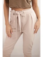 Dámské kalhoty z bavlny s vázáním v pase a zúženými nohavicemi béžové Dámské kalhoty z bavlny s vázáním v pase a zúženými nohavicemi béžové