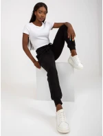 B 005 tepláky.11X černá