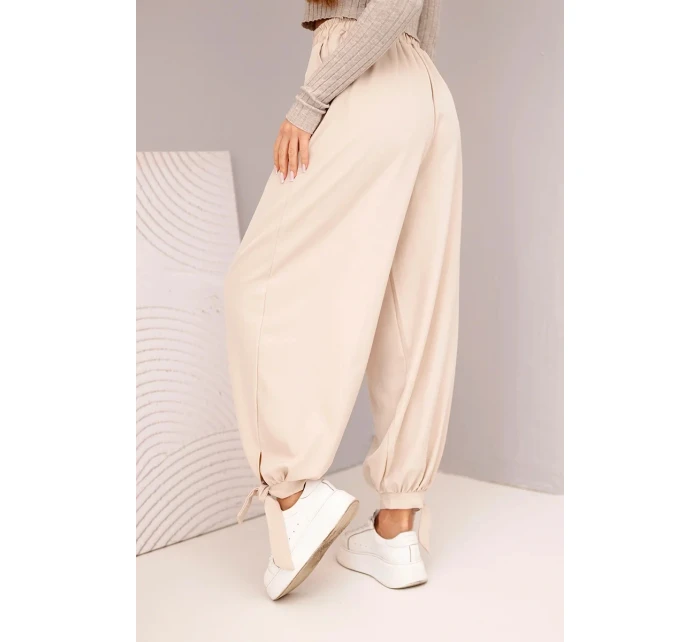 Dámské kalhoty s širokým nohavicí a vázáním dole béžové