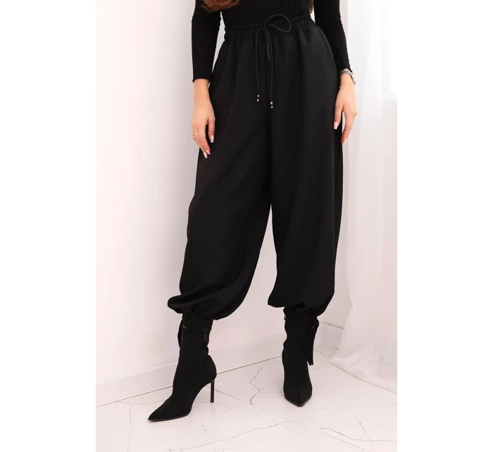 Dámské kalhoty s širokou nohavicí a zavazováním dole černé Dámské kalhoty s širokou nohavicí a zavazováním dole černé