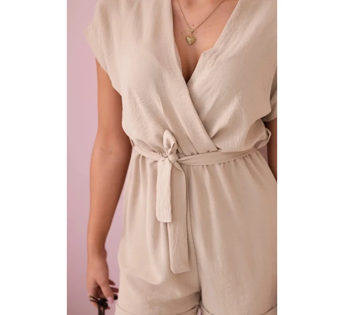 Krátký overal zavazovaný v pase béžový