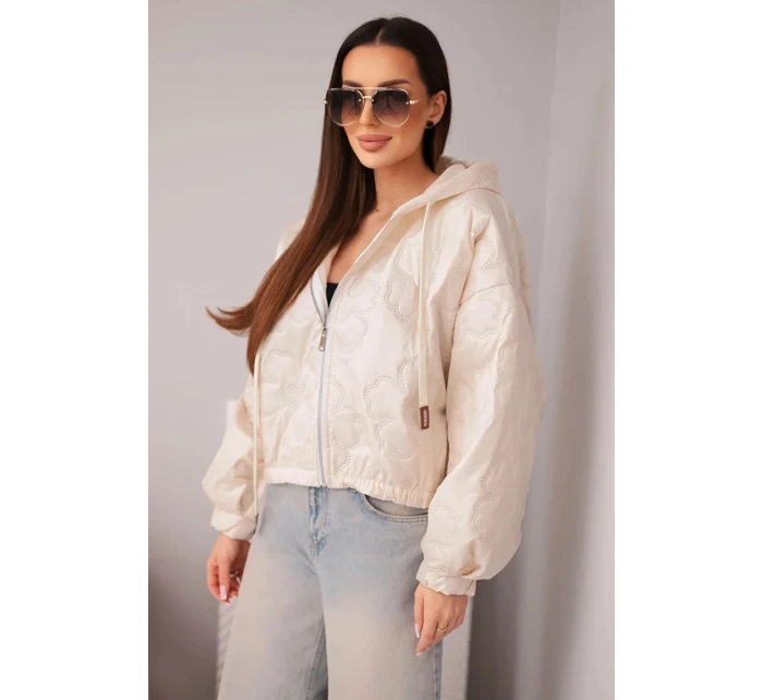 Dámská prošívaná bunda s kapucí a ozdobným květinovým ražením béžová