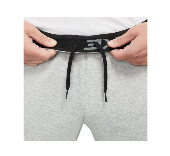 Pánské tréninkové kalhoty Dri-Fit Trapered M CZ6379-063 šedé - Nike Pánské tréninkové kalhoty Dri-Fit Trapered M CZ6379-063 šedé - Nike