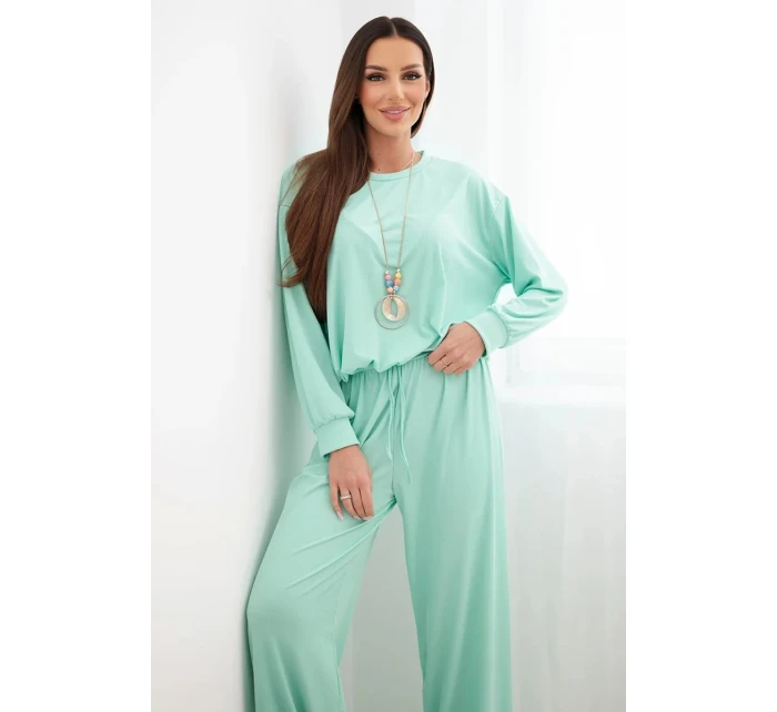 Dámský komplet z model 21951985 mikina s přívěskem a široké kalhoty mentolová - K-Fashion Dámský komplet z model 21951985 mikina s přívěskem a široké kalhoty mentolová - K-Fashion