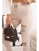 Dámské kalhoty z bavlny s roztržením a gumou v pase béžové