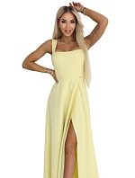 dlouhé šaty s rozparkem a výstřihem typu  žluté s třpytkami model 22092786 - numoco