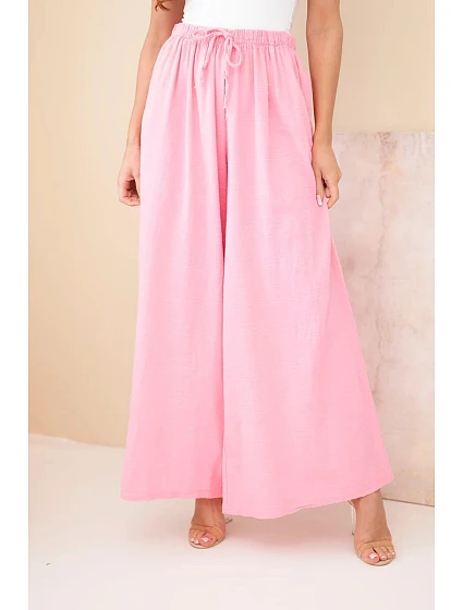 Dámské široké bavlněné kalhoty s gumou v pase cukrově růžová Dámské široké bavlněné kalhoty s gumou v pase cukrově růžová