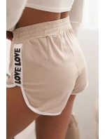 Dámské bavlněné šortky s elastickým pasem a sportovním lemem béžové Dámské bavlněné šortky s elastickým pasem a sportovním lemem béžové