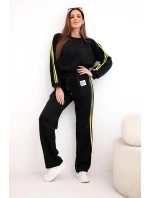 Dámský teplákový komplet Masełko s lampasy a volnou mikinou černý Dámský teplákový komplet Masełko s lampasy a volnou mikinou černý