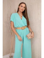 Kombinéza s ozdobným páskem v pase světle mátová Kombinéza s ozdobným páskem v pase světle mátová