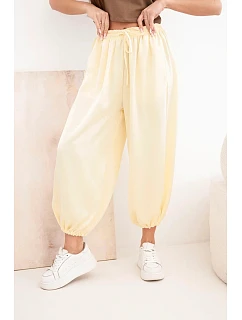 Dámské široké kalhoty s gumou v pase a zavazováním ve stylu model 22064411 žluté - K-Fashion