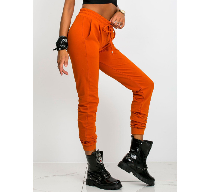 Tmavě oranžové kalhoty Faster