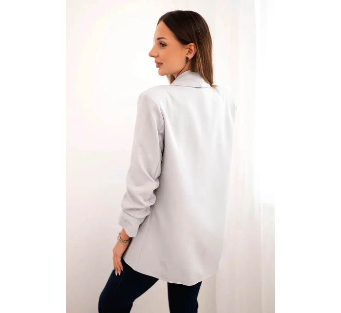 Šedé sako s klopami elegantní