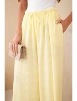 Dámské široké bavlněné kalhoty s gumičkou v pase žluté Dámské široké bavlněné kalhoty s gumičkou v pase žluté