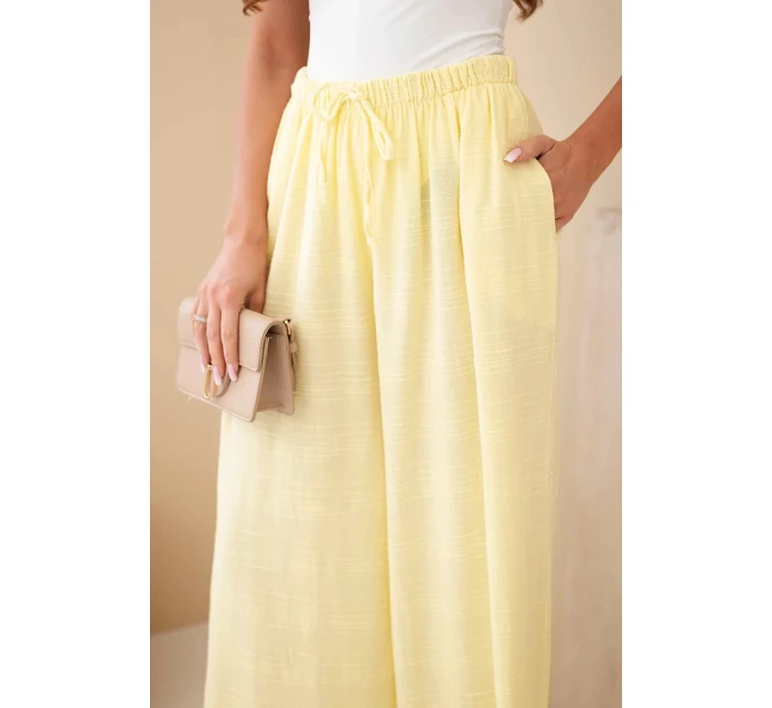 Dámské široké bavlněné kalhoty s gumičkou v pase žluté Dámské široké bavlněné kalhoty s gumičkou v pase žluté