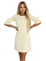 Dámské trapézové šaty s vázáním na rukávech pastelově žluté model 22022940 - numoco