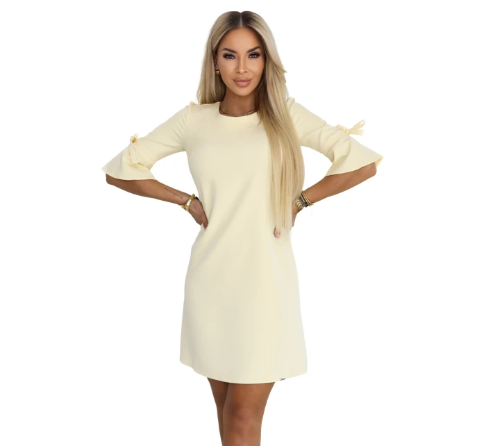 Dámské trapézové šaty s vázáním na rukávech pastelově žluté model 22022940 - numoco