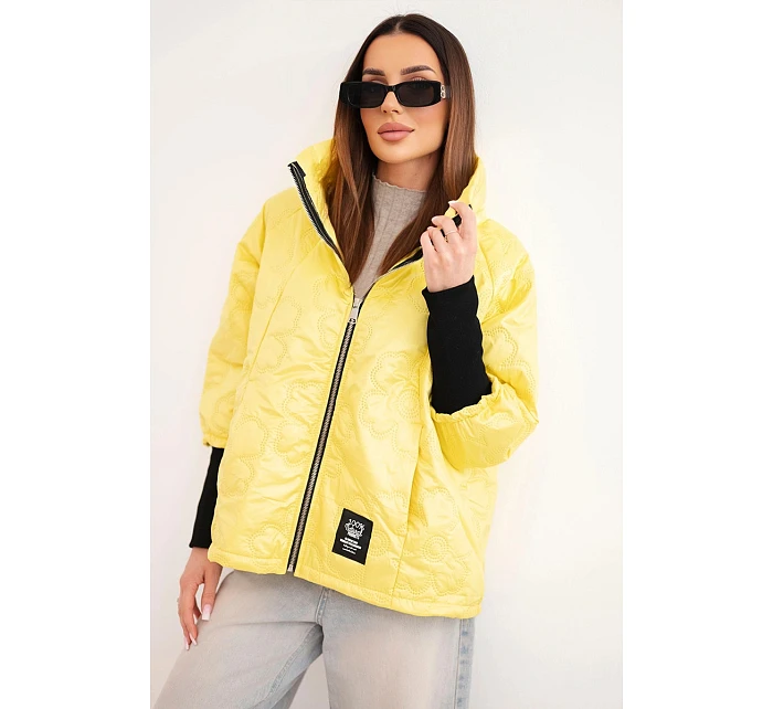 Dámská jarní prošívaná bunda s ozdobným model 22040176 a zipem žlutá - K-Fashion