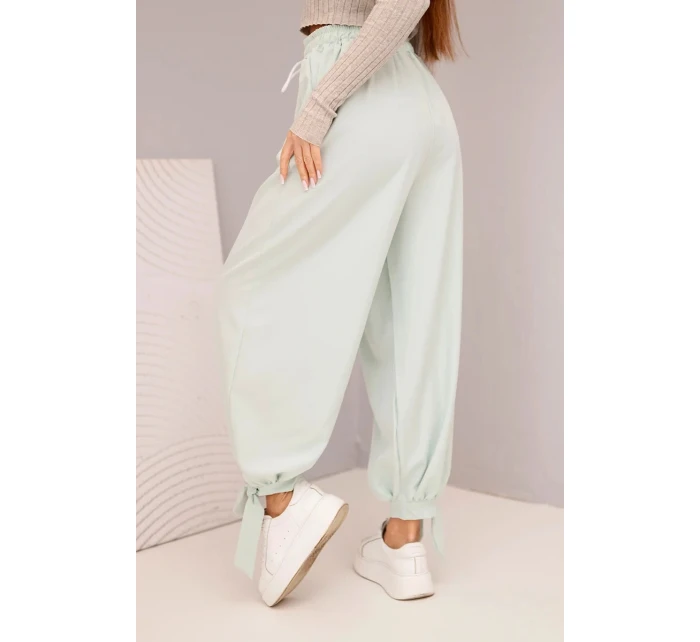 Dámské kalhoty se širokými nohavicemi a zavazováním dole tmavě mátové