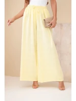 Dámské široké bavlněné kalhoty s gumičkou v pase žluté Dámské široké bavlněné kalhoty s gumičkou v pase žluté