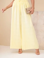 Dámské široké bavlněné kalhoty s gumičkou v pase žluté