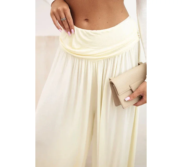 Dámské viskózové kalhoty s širokými nohavicemi a volánky žlutý