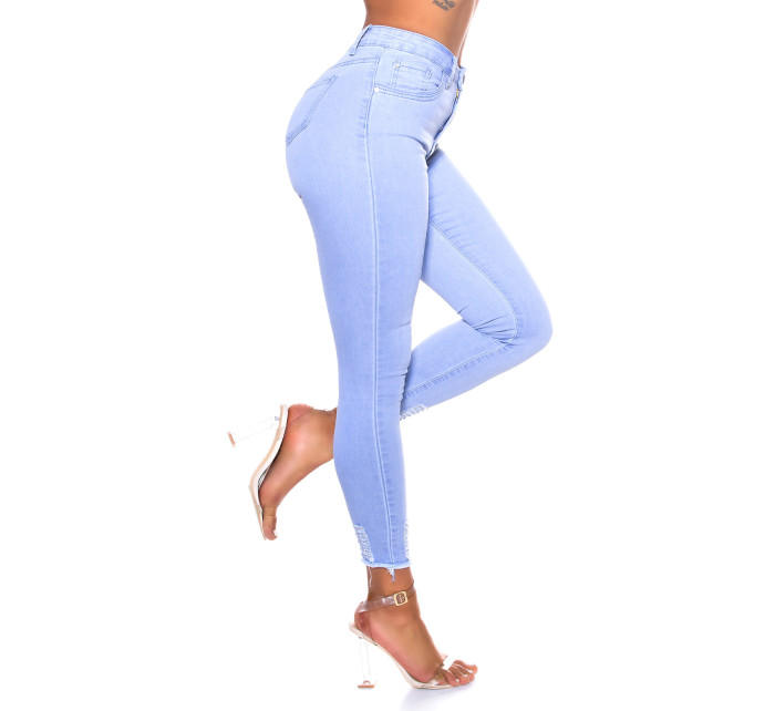 Sexy skinny džíny sepraného vzhledu s roztrženým lemem