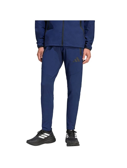 Pánské kalhoty Tiro 26 Travel Woven navy blue model 22062501 - ADIDAS