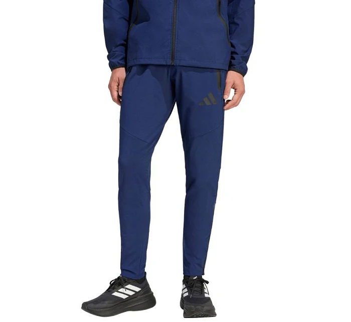 Pánské kalhoty Tiro 26 Travel Woven navy blue model 22062501 - ADIDAS