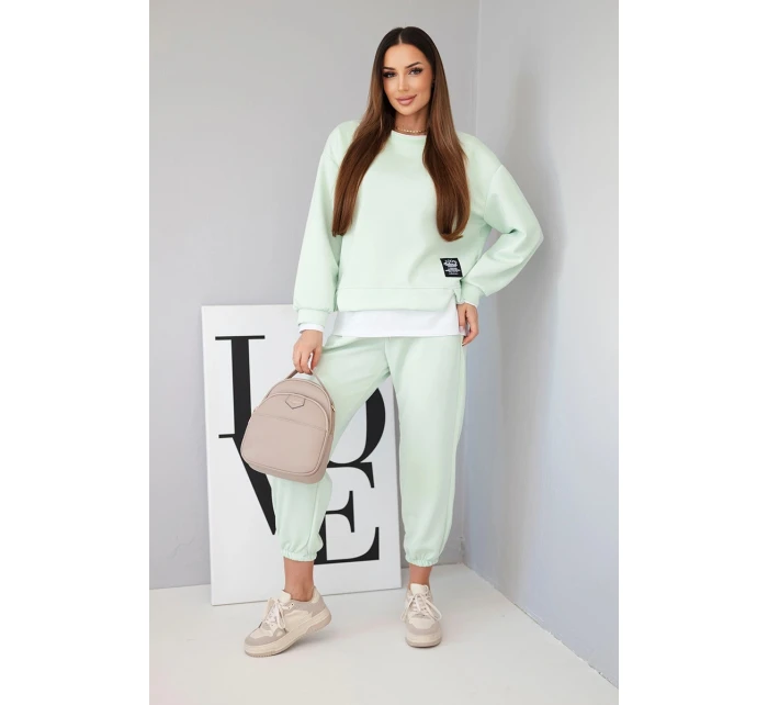 Dámský komplet s volnou mikinou a tepláky jasně mátová model 21808631 - K-Fashion Dámský komplet s volnou mikinou a tepláky jasně mátová model 21808631 - K-Fashion