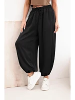 Dámské široké kalhoty s gumou v pase a vázáním ve stylu model 22064413 černé - K-Fashion