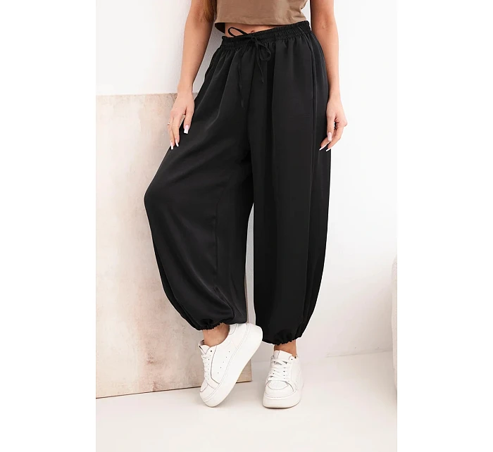 Dámské široké kalhoty s gumou v pase a vázáním ve stylu model 22064413 černé - K-Fashion
