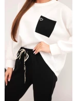 Dámská souprava máslová s kontrastní kapsou černý