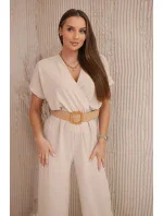Kombinéza s ozdobným páskem v pase béžová Kombinéza s ozdobným páskem v pase béžová