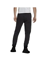 Fleecové kalhoty adidas Essentials Camo Print M HL6929