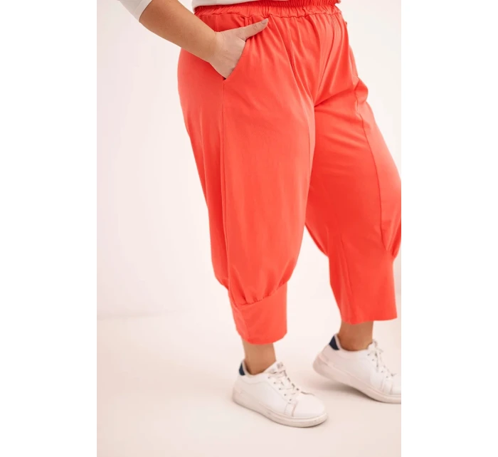 Dámské kalhoty Plus Size s nízkým sedem a gumou v pase korálové