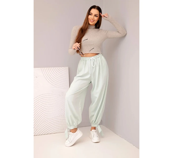 Dámské kalhoty se širokými nohavicemi a zavazováním dole tmavě mátové