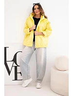 Dámská jarní prošívaná bunda s kapucí a zipem tmavě žlutá