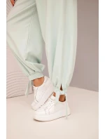 Dámské kalhoty se širokými nohavicemi a zavazováním dole tmavě mátové