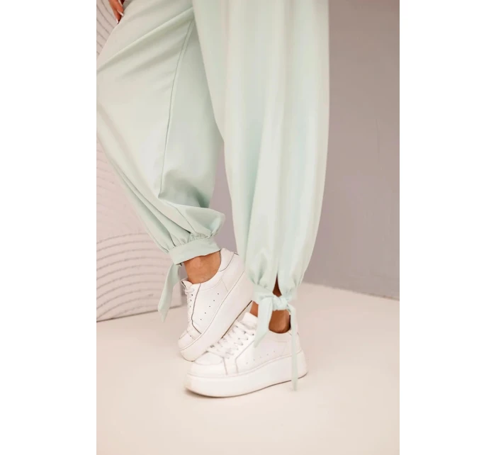 Dámské kalhoty se širokými nohavicemi a zavazováním dole tmavě mátové