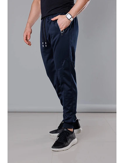 Tmavě modré pánské teplákové kalhoty se stahovacími lemy model 18345024 - J.STYLE Tmavě modré pánské teplákové kalhoty se stahovacími lemy model 18345024 - J.STYLE