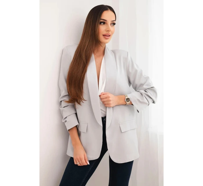 Šedé sako s klopami elegantní