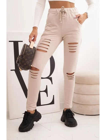 Dámské kalhoty z bavlny s roztržením a gumou v pase béžové